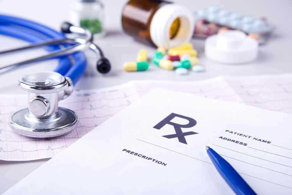 Concept Postoperative Anticoagulation Instructions at Discharge. prescription-pills-stethoscope.